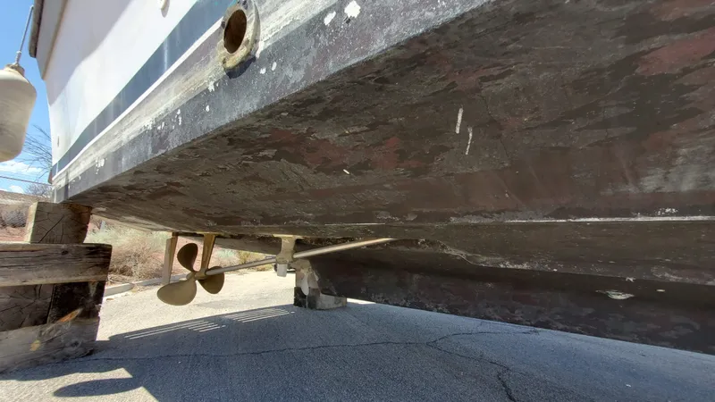 Slide: The Image of 1985 Silverton 40 Aft Cabin boat hull and propellers on dry dock. - 32