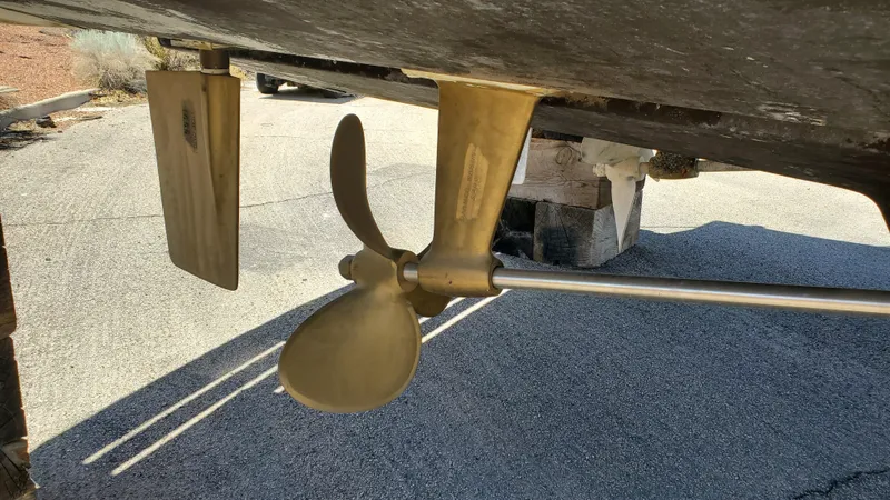 Slide: The Image of Propeller and rudder of 1985 Silverton 40 Aft Cabin boat on dry dock. - 33