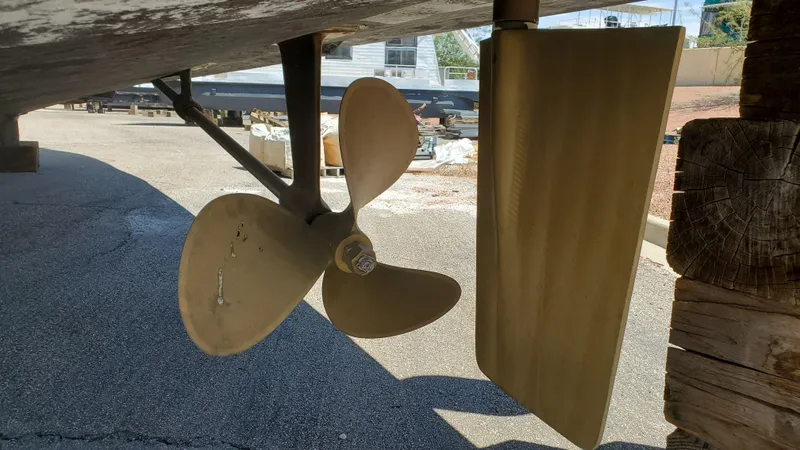 Slide: The Image of Propeller and rudder of 1985 Silverton 40 Aft Cabin boat on dry dock. - 34