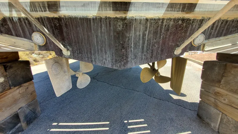 Slide: The Image of 1985 Silverton 40 Aft Cabin boat underside with propellers and rudders visible. - 39