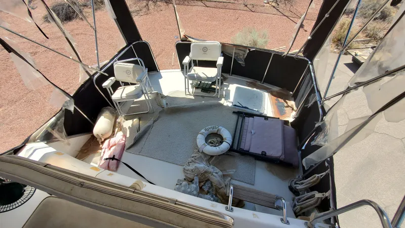 Slide: The Image of 1985 Silverton 40 Aft Cabin boat interior with chairs and life preserver. - 40