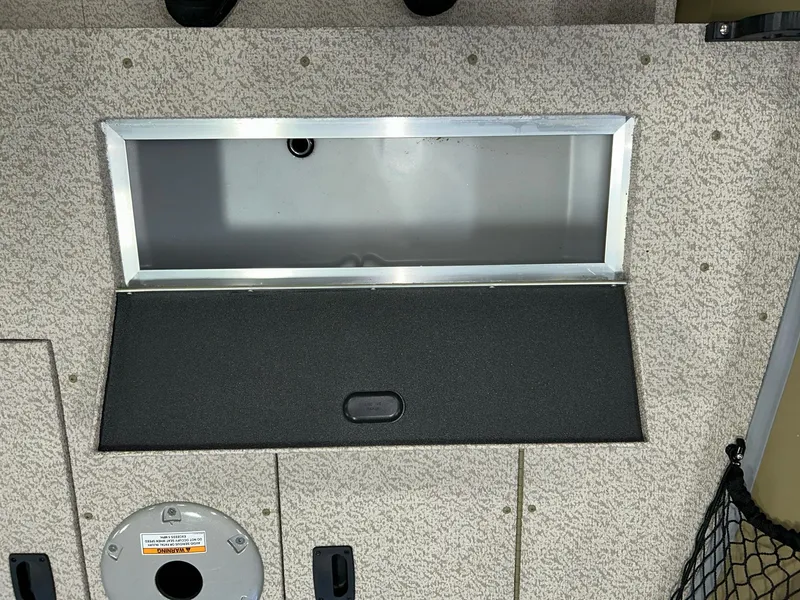 Slide: The Image of 2023 Crestliner 1650 Discovery Tiller boat interior storage compartment. - 13