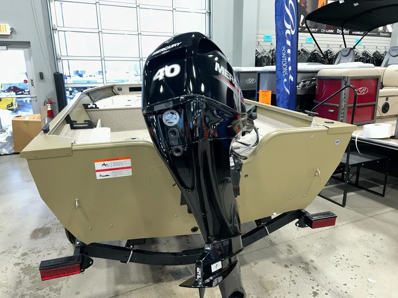 Slide: The Image of 2023 Crestliner 1650 Discovery Tiller boat with Mercury 40 engine in showroom. - 3