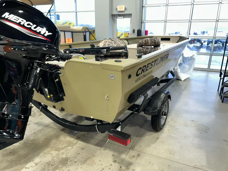 Slide: The Image of 2023 Crestliner 1650 Discovery Tiller boat with Mercury engine in showroom. - 4