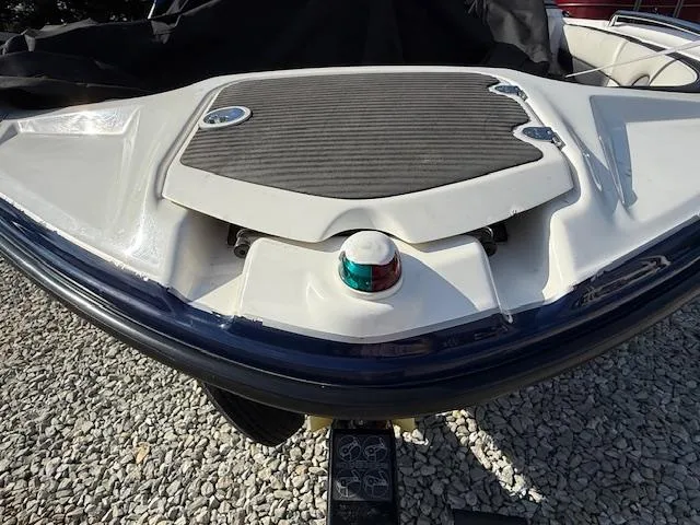 Slide: The Image of 2015 Yamaha Boats SX210 bow with navigation light and non-slip deck. - 4