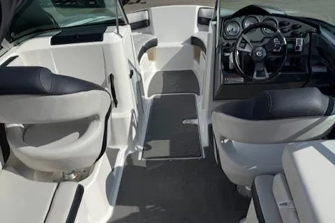 Slide: The Image of 2015 Yamaha Boats SX210 interior with sleek seating and modern dashboard design. - 6