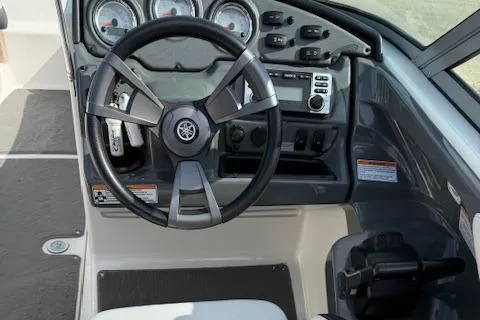 Slide: The Image of 2015 Yamaha Boats SX210 dashboard with steering wheel and control panel. - 7
