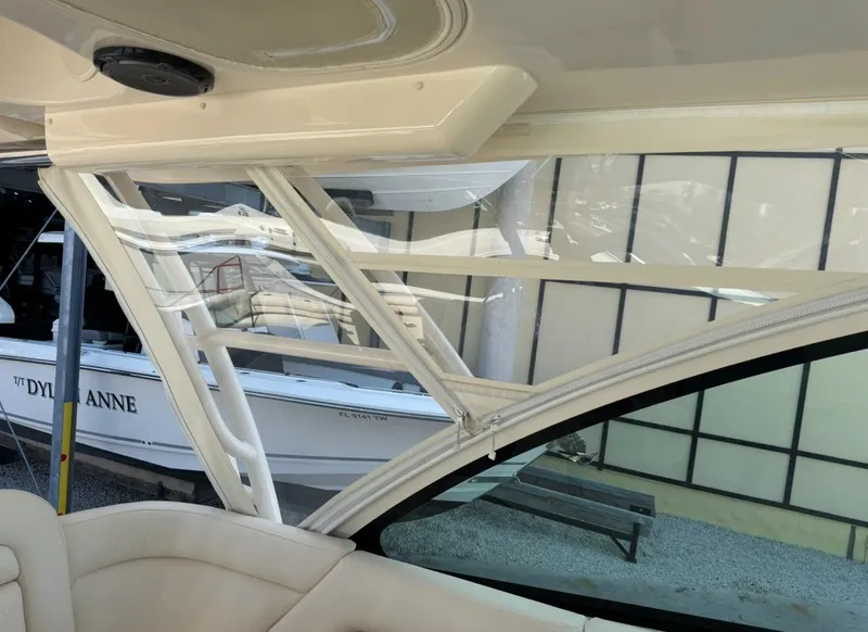Slide: The Image of Interior view of a 2019 Grady-White Freedom 375 boat, showcasing seating and window design. - 14