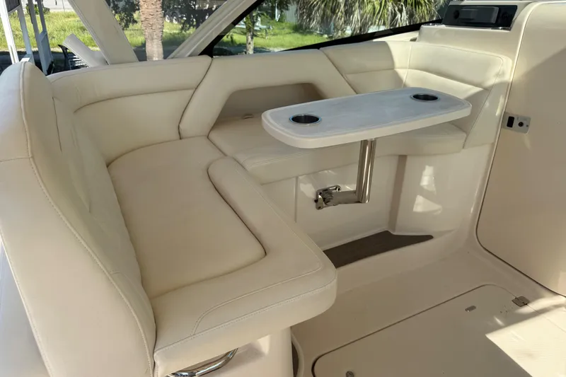 Slide: The Image of 2019 Grady-White Freedom 375 boat interior with beige seating and table. - 15