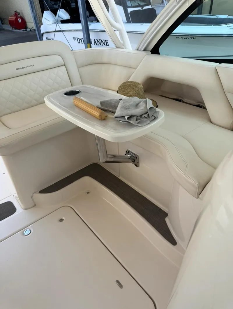 Slide: The Image of 2019 Grady-White Freedom 375 boat interior with seating and table setup. - 16
