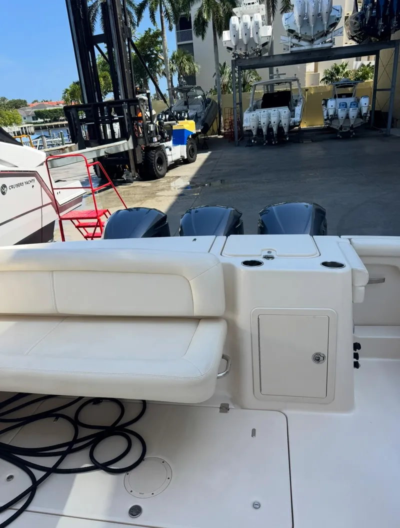 Slide: The Image of 2019 Grady-White Freedom 375 boat with triple engines, docked near storage facility. - 17