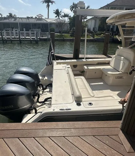 Slide: The Image of 2019 Grady-White Freedom 375 boat docked with triple Yamaha engines. - 18