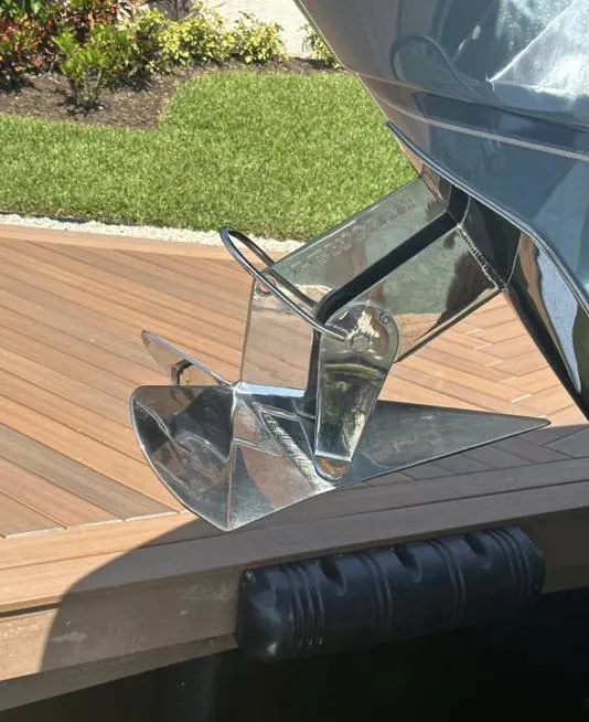 Slide: The Image of 2019 Grady-White Freedom 375 boat anchor on wooden dock, sunny day. - 19