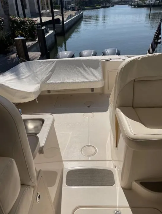 Slide: The Image of 2019 Grady-White Freedom 375 boat interior with seating and water view. - 24
