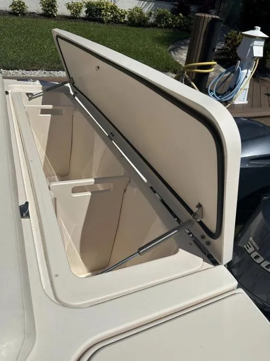 Slide: The Image of Open storage compartment on 2019 Grady-White Freedom 375 boat, docked outdoors. - 31