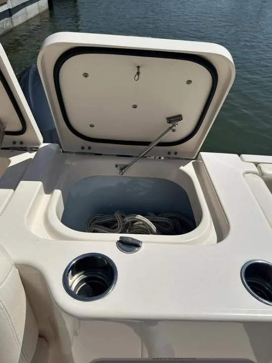 Slide: The Image of Open storage compartment on 2019 Grady-White Freedom 375 boat, with ropes inside. - 32