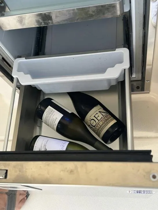 Slide: The Image of Open drawer with wine bottles on a 2019 Grady-White Freedom 375 boat. - 33
