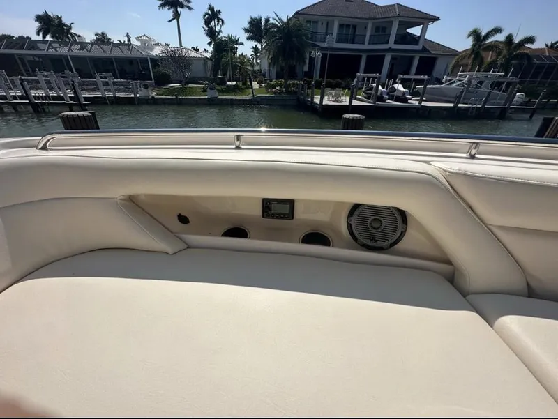 Slide: The Image of 2019 Grady-White Freedom 375 boat interior with speaker and control panel, dockside view. - 36