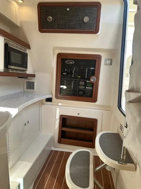Slide: The Image of 2019 Grady-White Freedom 375 interior with control panel and seating area. - 39