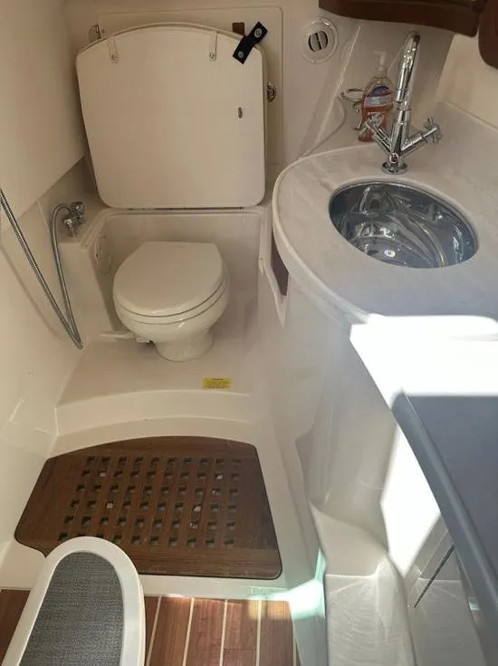 Slide: The Image of 2019 Grady-White Freedom 375 boat bathroom with toilet, sink, and wooden floor mat. - 41