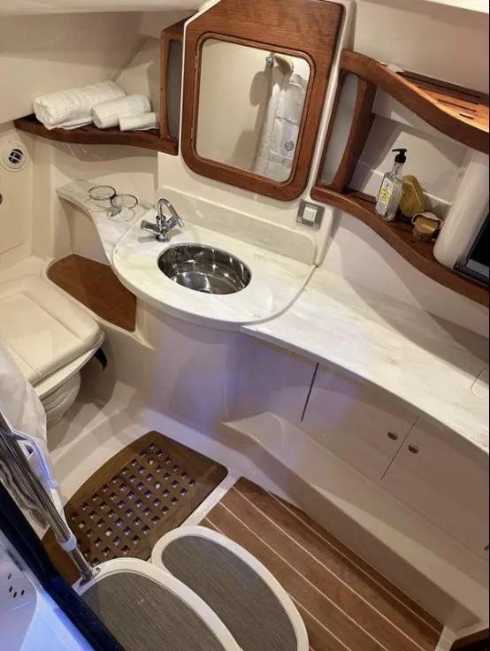 Slide: The Image of Luxurious bathroom interior of 2019 Grady-White Freedom 375 boat with wooden accents. - 42