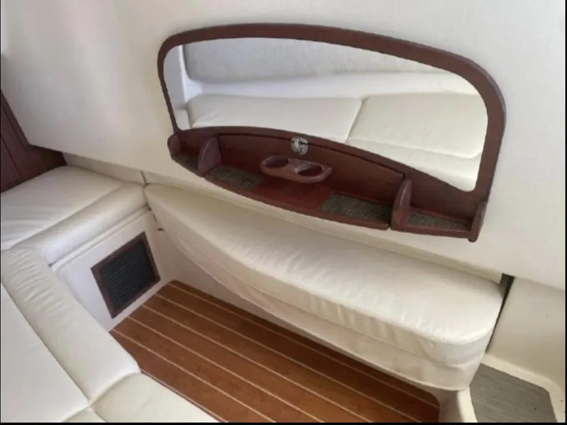 Slide: The Image of 2019 Grady-White Freedom 375 interior with cushioned seating and wooden accents. - 43