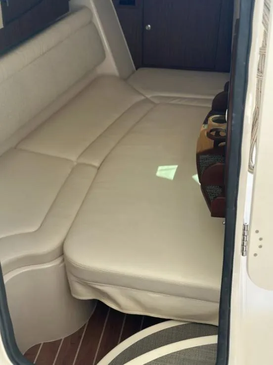 Slide: The Image of Interior of 2019 Grady-White Freedom 375 boat with beige seating and wooden accents. - 44