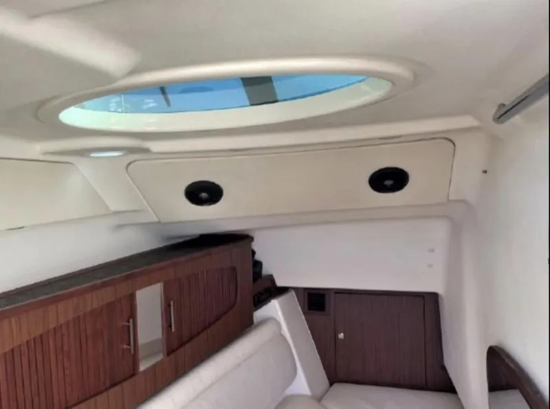 Slide: The Image of 2019 Grady-White Freedom 375 cabin interior with skylight and wooden cabinetry. - 45