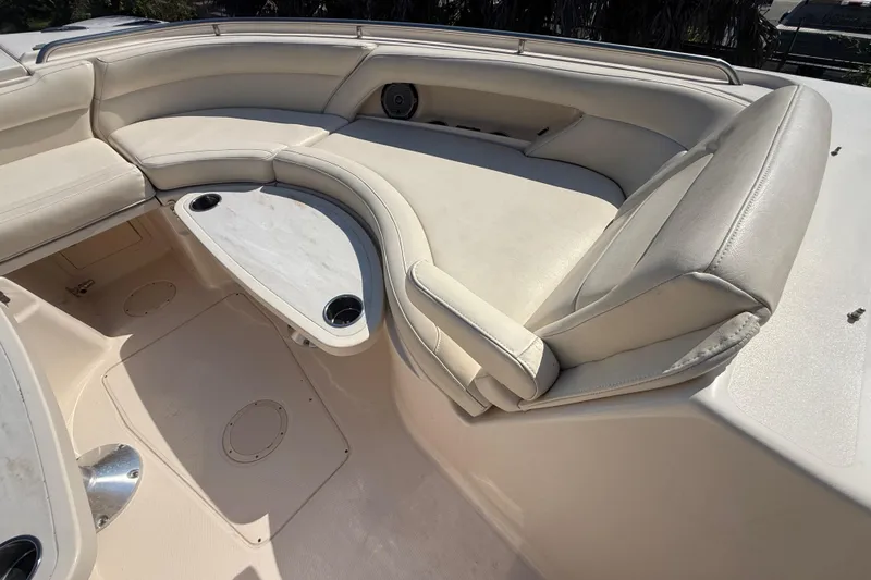 Slide: The Image of 2019 Grady-White Freedom 375 boat interior with cushioned seating and cup holders. - 57