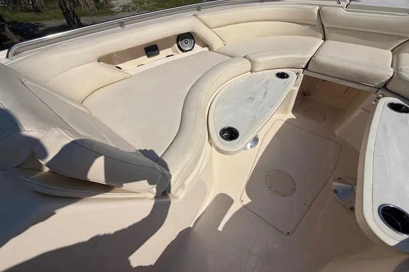 Slide: The Image of 2019 Grady-White Freedom 375 boat interior with beige seating and cup holders. - 58
