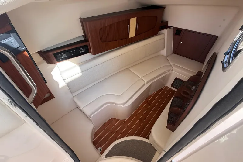 Slide: The Image of 2019 Grady-White Freedom 375 cabin interior with elegant seating and wood accents. - 60