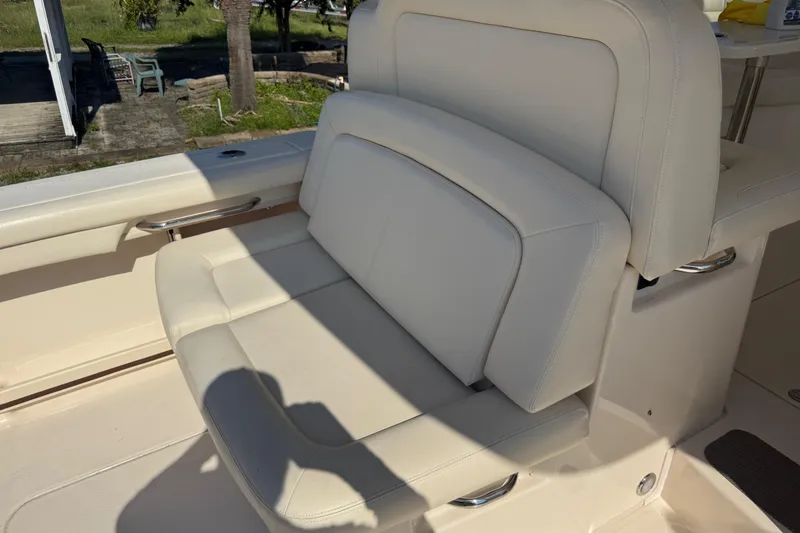 Slide: The Image of 2019 Grady-White Freedom 375 boat seat with white upholstery and sleek design. - 63