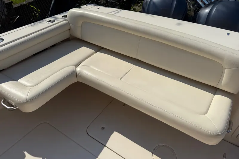 Slide: The Image of 2019 Grady-White Freedom 375 boat with beige leather seating in sunlight. - 64