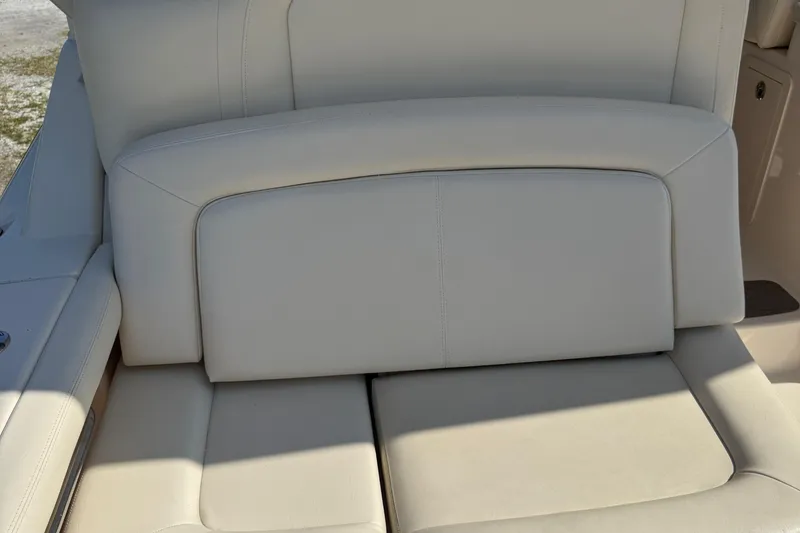 Slide: The Image of 2019 Grady-White Freedom 375 boat seat, beige leather upholstery, close-up view. - 65