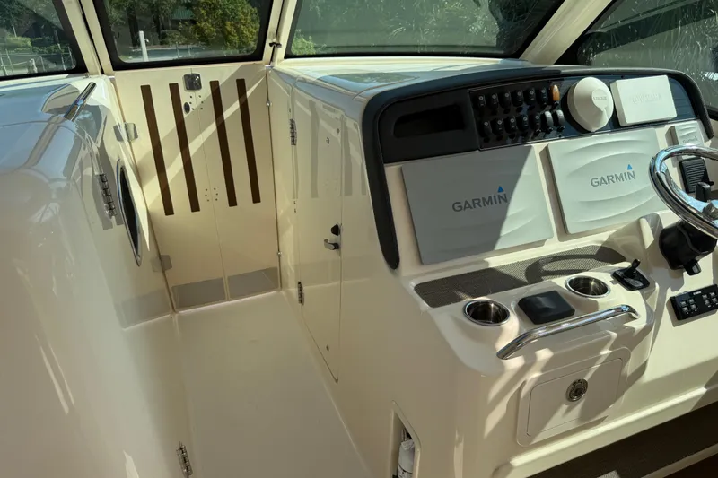 Slide: The Image of 2019 Grady-White Freedom 375 helm with Garmin navigation system and modern controls. - 67