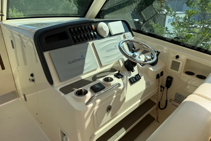 Slide: The Image of 2019 Grady-White Freedom 375 helm with Garmin navigation and steering wheel. - 68