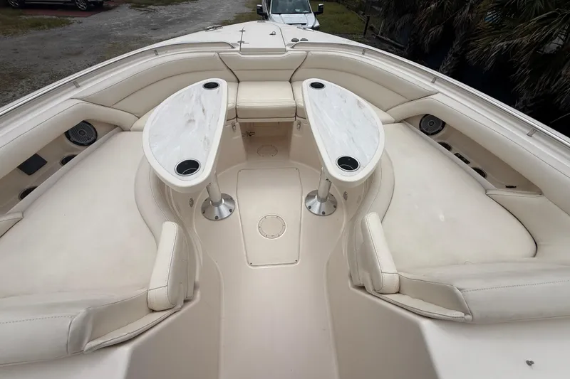 Slide: The Image of 2019 Grady-White Freedom 375 boat interior with cushioned seating and dual tables. - 69