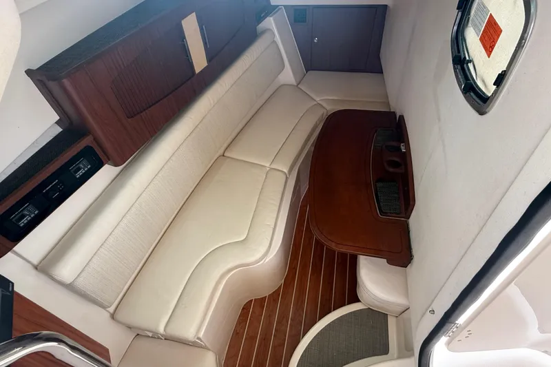 Slide: The Image of 2019 Grady-White Freedom 375 cabin interior with elegant seating and wooden accents. - 70