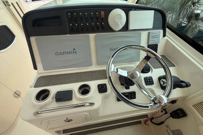 Slide: The Image of 2019 Grady-White Freedom 375 helm with Garmin navigation and steering wheel. - 71