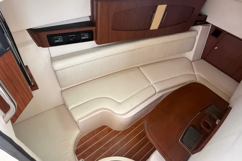 Slide: The Image of 2019 Grady-White Freedom 375 cabin interior with cream seating and wooden accents. - 72