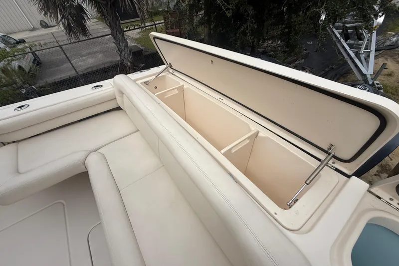 Slide: The Image of 2019 Grady-White Freedom 375 boat with open storage compartment, showcasing spacious seating. - 78
