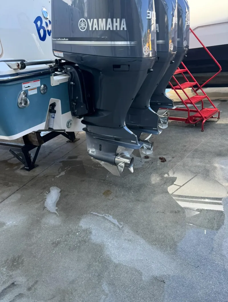 Slide: The Image of Triple Yamaha outboard motors on a 2019 Grady-White Freedom 375 boat. - 8