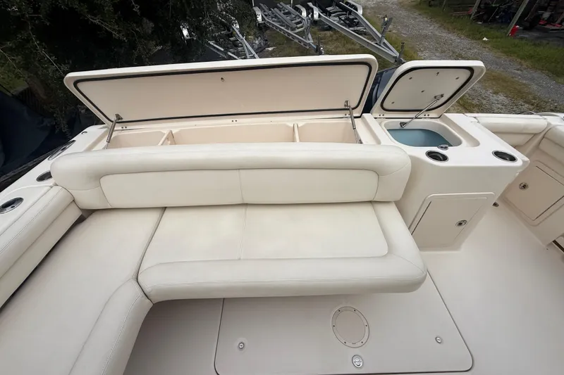 Slide: The Image of 2019 Grady-White Freedom 375 boat interior with open storage and seating area. - 80