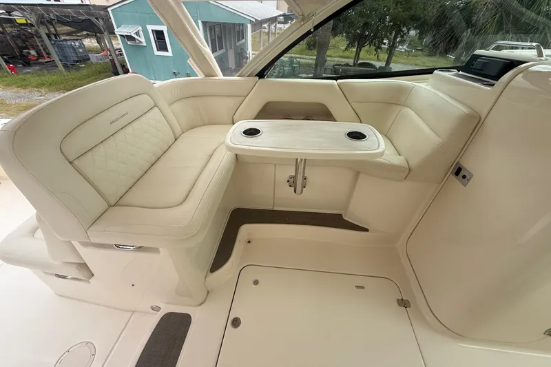 Slide: The Image of 2019 Grady-White Freedom 375 boat interior with beige seating and table. - 81