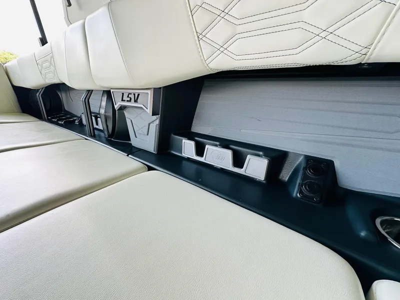 Slide: The Image of 2023 Malibu 25LSV interior with white leather seats and sleek design elements. - 21