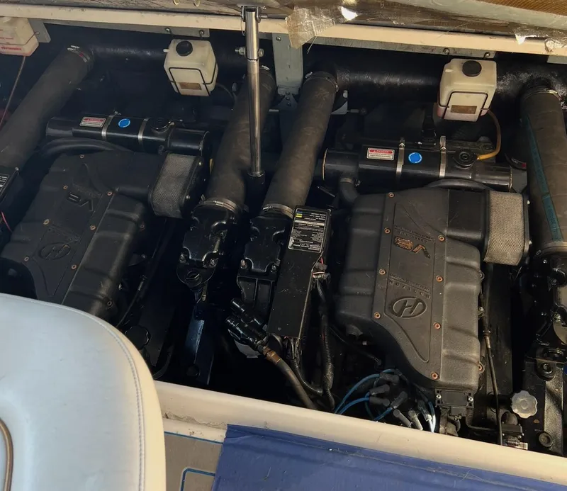Slide: The Image of Engine compartment of a 1998 Sea Ray 330 Sundancer boat, showcasing dual engines. - 18