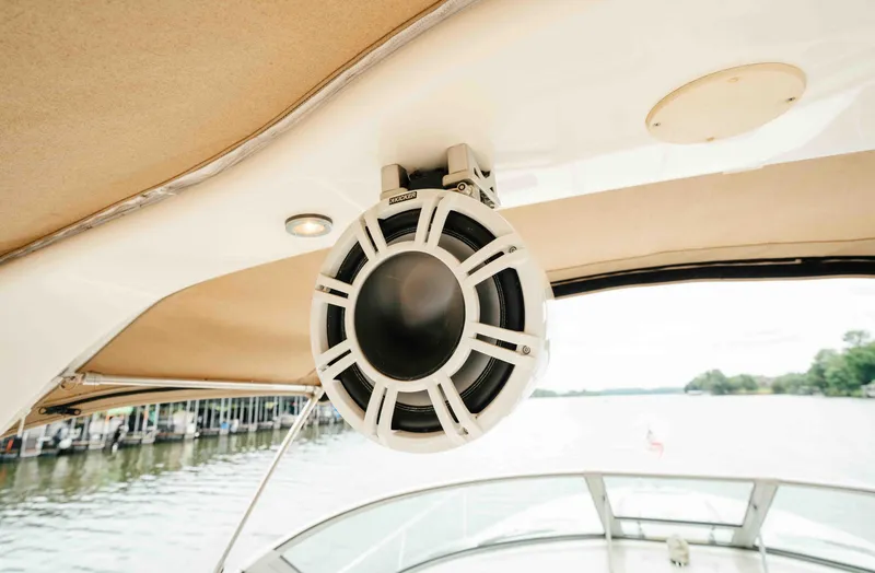 Slide: The Image of Speaker on a 2000 Sea Ray 340 Sundancer boat, with water and trees in the background. - 12