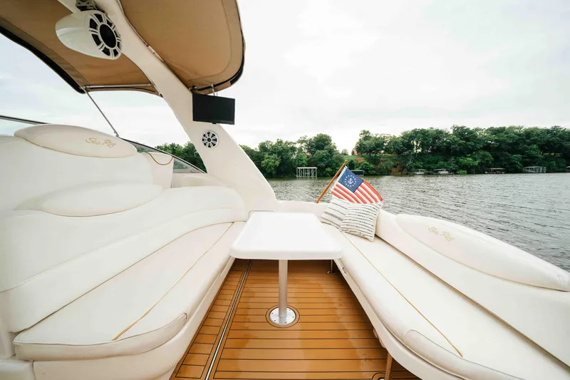 Slide: The Image of Luxurious 2000 Sea Ray 340 Sundancer yacht interior with plush seating and scenic water view. - 14