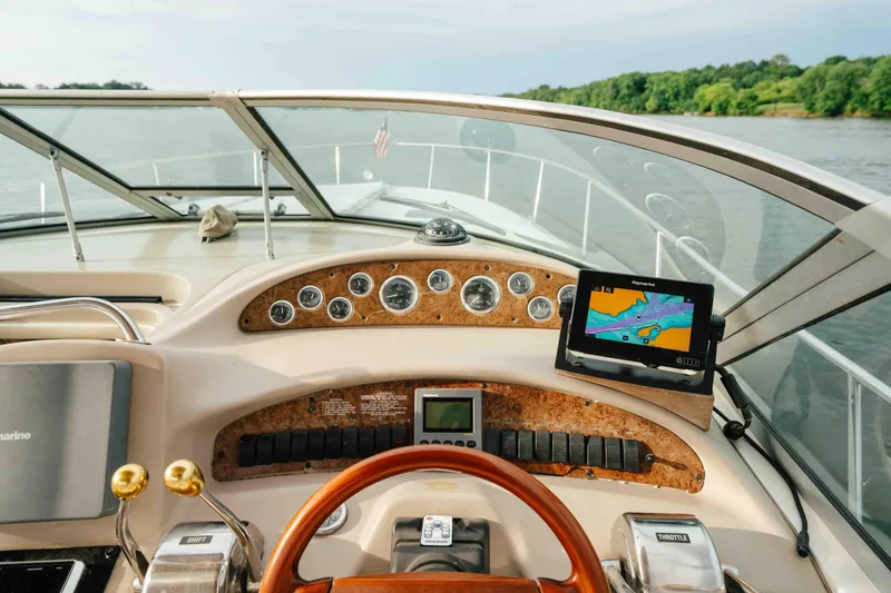 Slide: The Image of Cockpit view of 2000 Sea Ray 340 Sundancer with navigation system and gauges. - 28