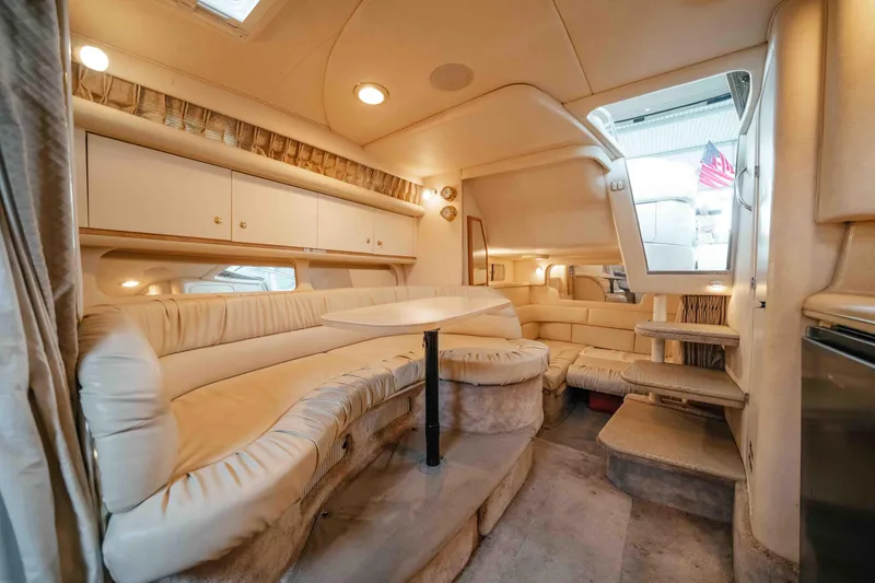 Slide: The Image of Luxurious interior of a 2000 Sea Ray 340 Sundancer yacht with plush seating and elegant design. - 33